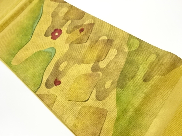 手織り紬金彩流水に椿・菱模様刺繍袋帯